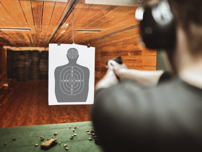 focused male trying to score high on gun practicing range
